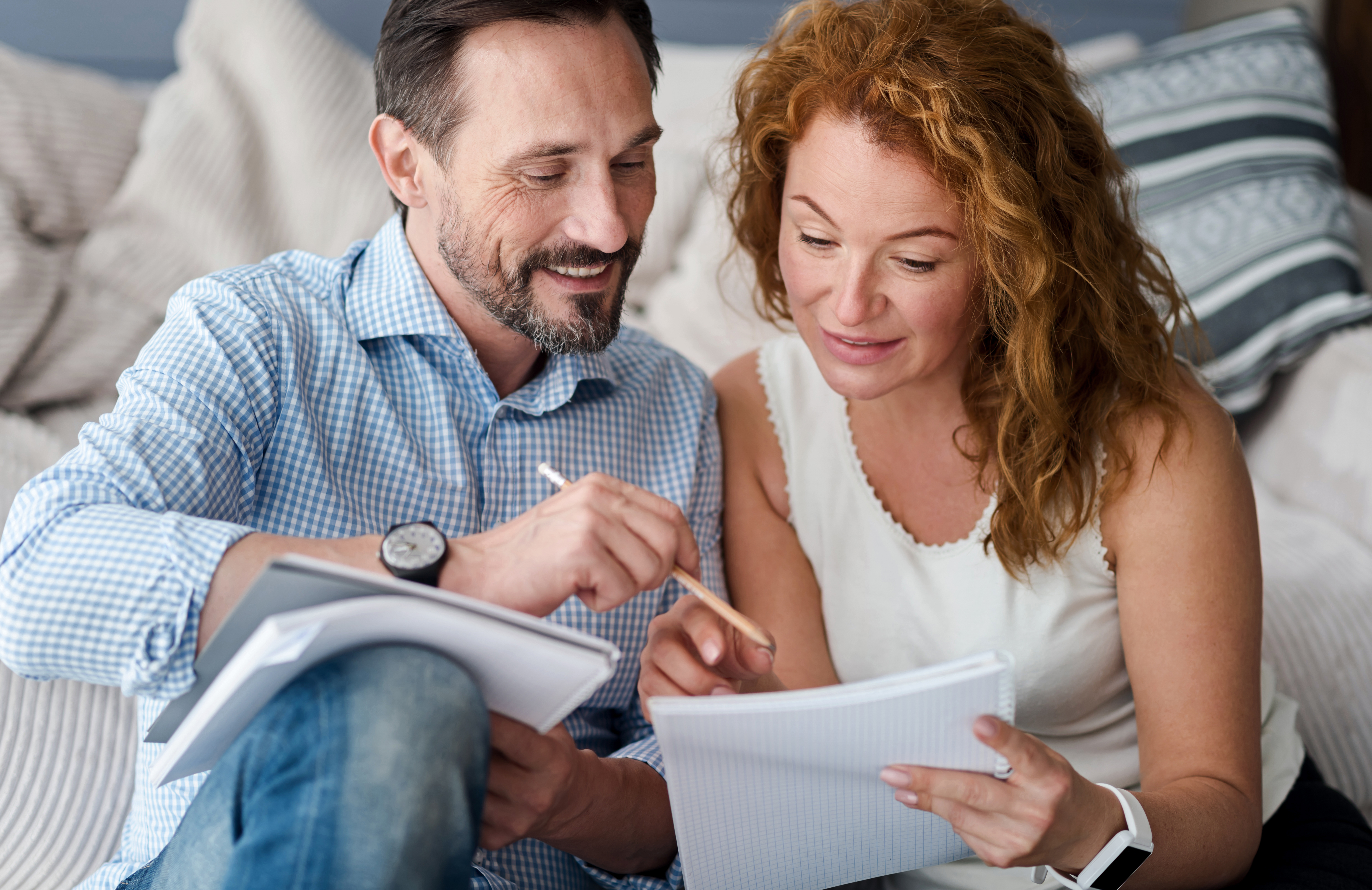 Image of Couple Comparing Notes